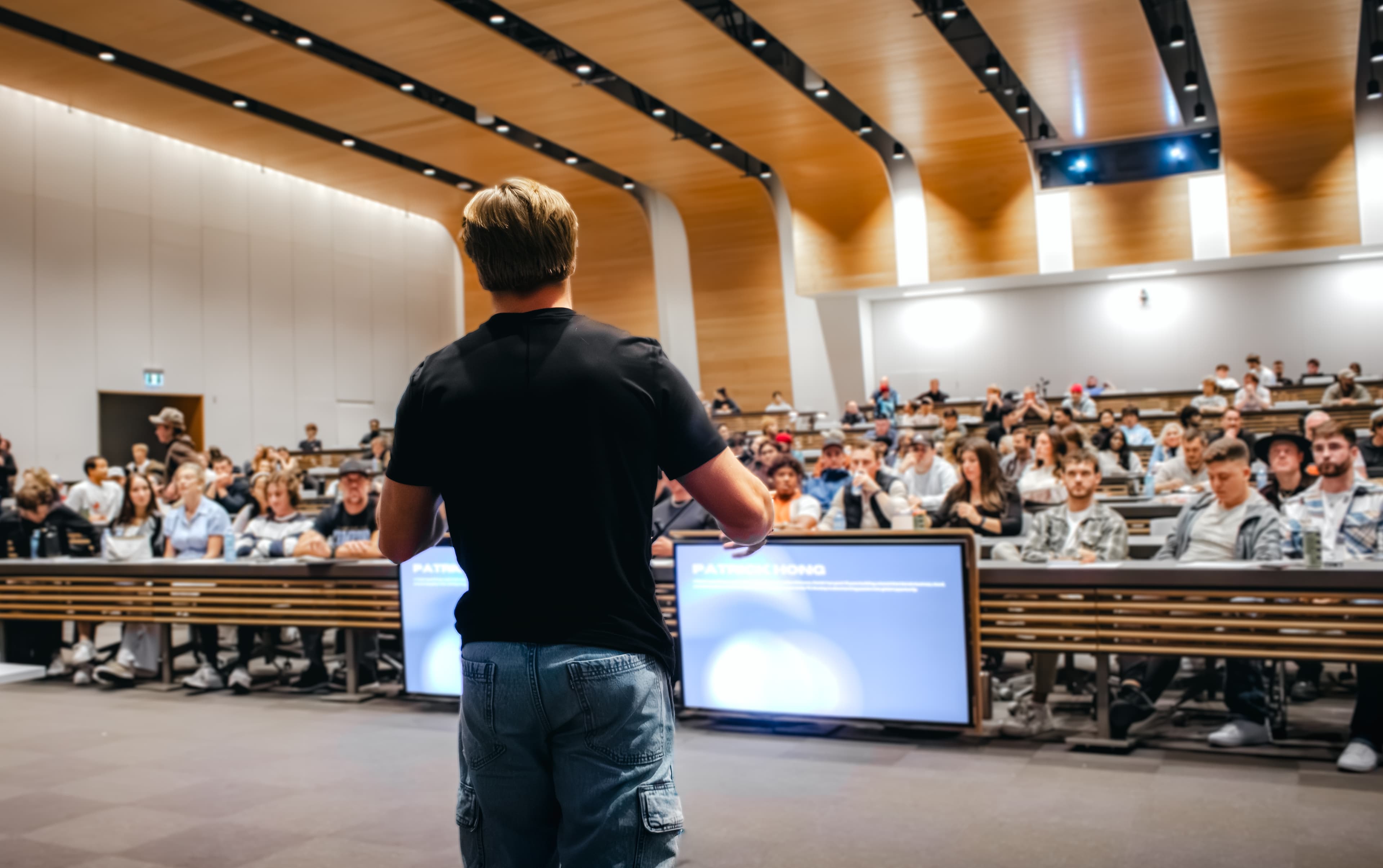 Karsen presenting to a packed lecture hall at Founders Club Event 1