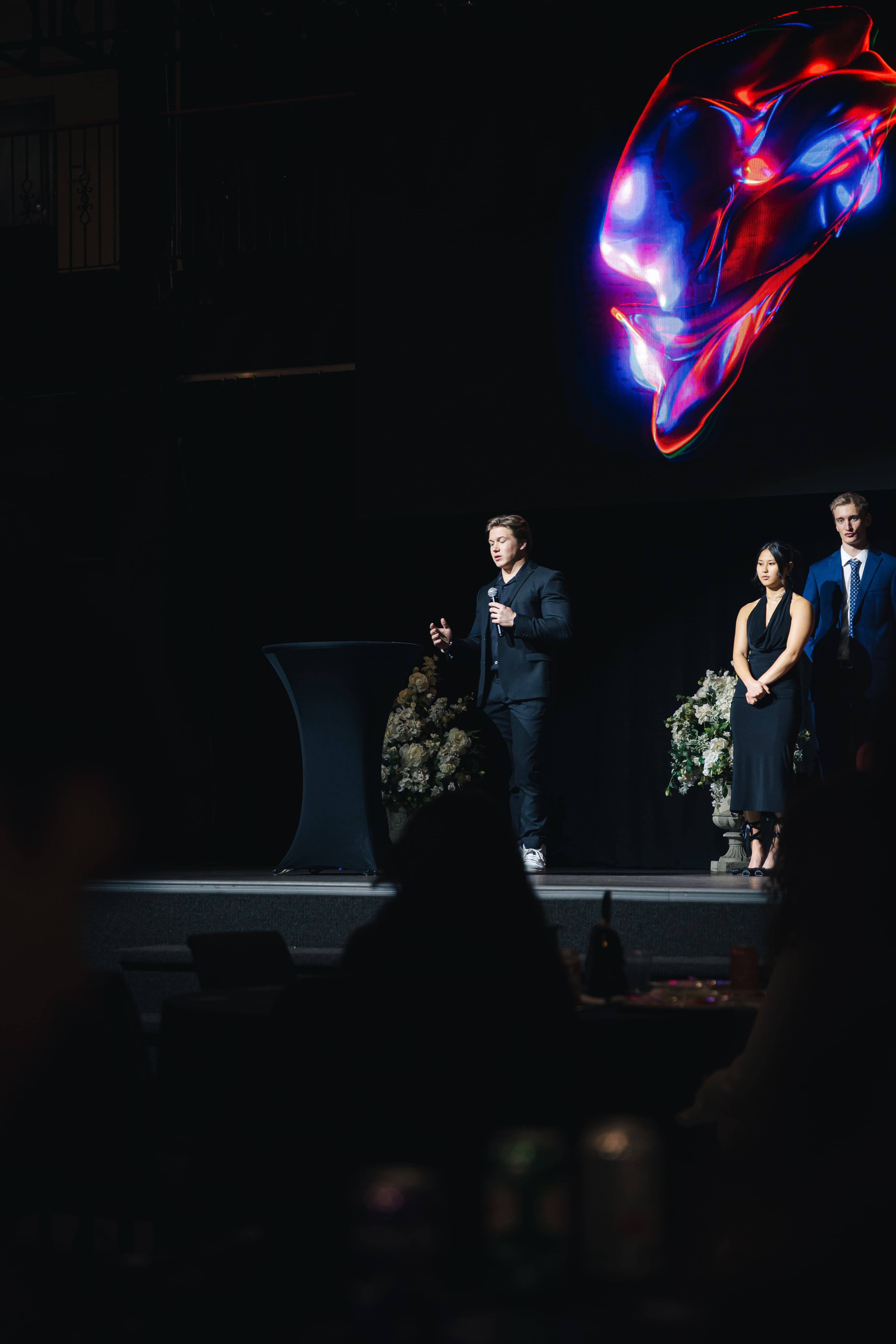 Karsen on stage speaking to audience